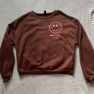 Large brown/pink sweater from shein. Never worn and in good condition.